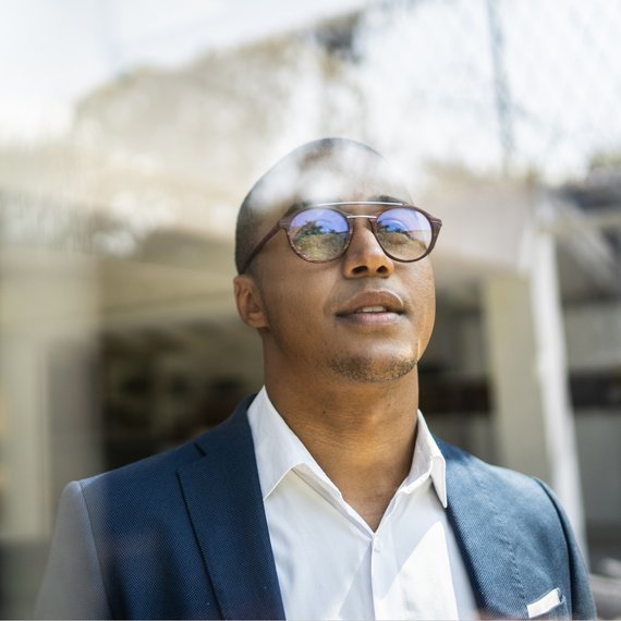Man in suit against a blurred background