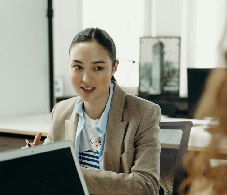 Individual at desk with laptop