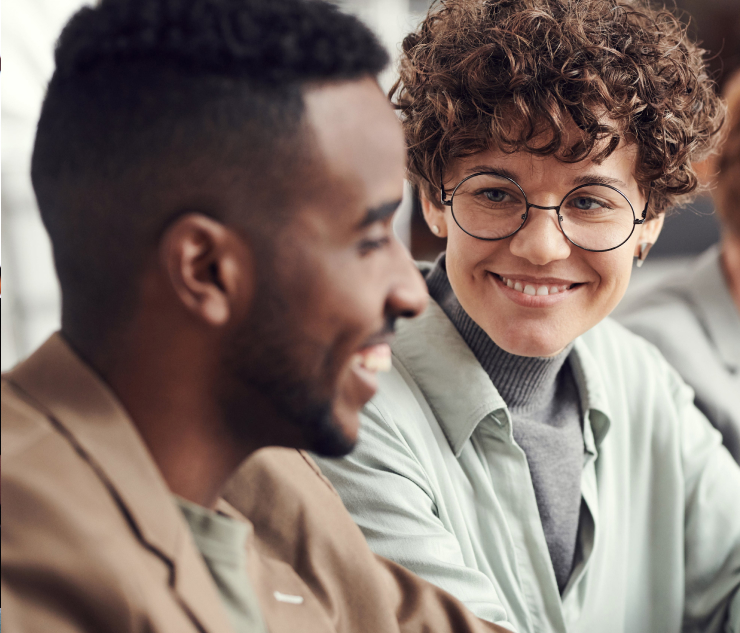 Individuals in casual attire in a discussion at a meeting