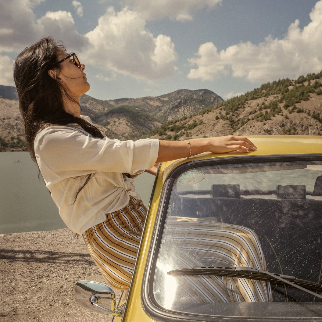 A person in a vehicle near a body of water